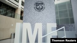 FILE PHOTO: International Monetary Fund logo is seen inside the headquarters at the end of the IMF/World Bank annual meetings