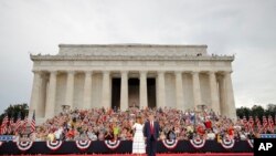 FILE - President Donald Trump and first lady Melania Trump arrive at an Independence Day celebration in front of the Lincoln Memorial, July 4, 2019, in Washington. 