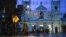 Sri Lankan soldiers stand guard in the rain at St. Anthony's Shrine in Colombo, April 25, 2019. Sri Lanka's Catholic church suspended all public services over security fears, and authorities urged Muslims to pray at home Friday rather than attend a mosque.