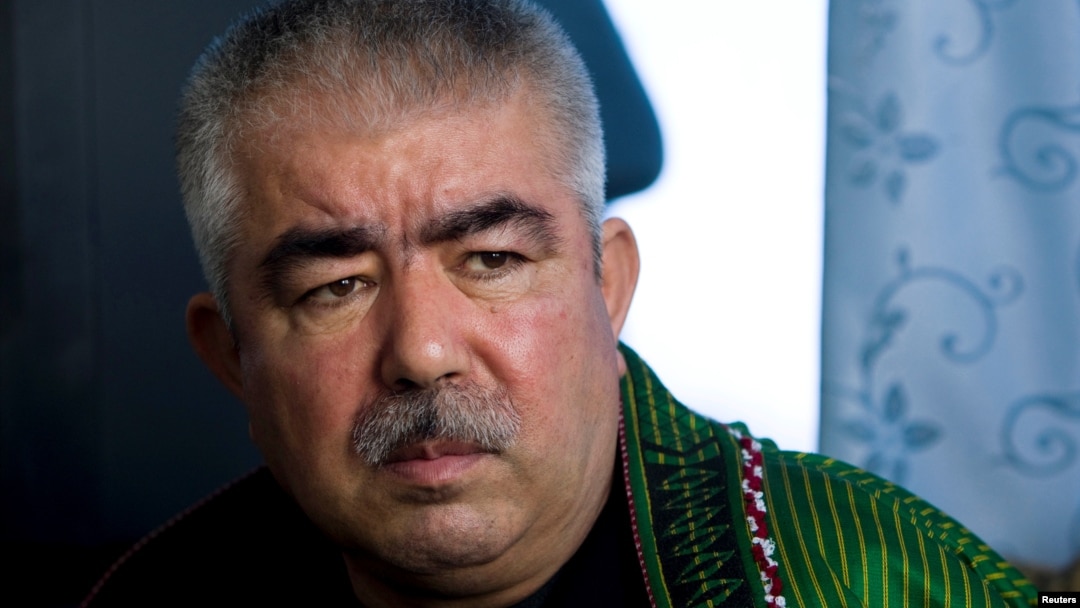 FILE - Abdul Rashid Dostum speaks during an interview in Shibergan, northern Afghanistan, Aug. 19, 2009. 