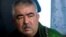 FILE - Abdul Rashid Dostum speaks during an interview in Shibergan, northern Afghanistan, Aug. 19, 2009. 