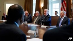 FILE - President Donald Trump speaks during a Cabinet meeting at the White House in Washington, Oct. 16, 2017. The White House has begun work on one of Trump’s next priorities: welfare reform. Trump said at the Cabinet meeting that welfare reform was “becoming a very, very big subject, and people are taking advantage of the system.”