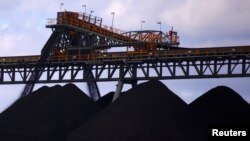 Coal is unloaded onto large piles at the Ulan Coal mines near the central New South Wales town of Mudgee in Australia, March 8, 2018. 