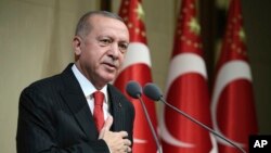 Turkish President Recep Tayyip Erdogan speaks during a reception on Republic Day, in Ankara, Turkey, Oct. 29, 2019. 