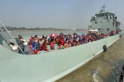 Rohingya refugees are transported on a naval vessel to Bhashan Char, or floating island, in the Bay of Bengal, from Chittagong, Bangladesh, Dec. 4, 2020.