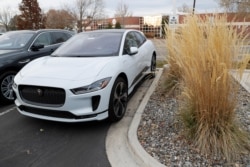 FILE - An unsold 2020 I-Pace electric vehicle sits at a Jaguar dealership in Littleton, Colorado, Nov. 10, 2019.