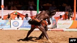 Traditional wrestlers fight during the National Sabre festival in Agadez, Niger, on December 31, 2023. Now in its 44th year, the National Saber event takes place this time under the banner "safeguarding the homeland."