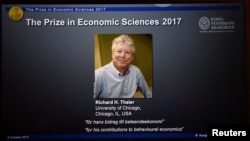 A photo of Richard H. Thaler, winner of the Nobel Prize in economic sciences 2017, officially called the Sveriges Riksbank Prize in Economic Sciences in Memory of Alfred Nobel, is seen during a press conference in Stockholm, Oct. 9, 2017. 