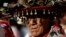 FILE - A Huichol elder, wearing a traditional hat, takes part in a protest in Mexico City, Oct. 27, 2011, against the construction of a silver mine in Wirikuta, one of the Huichol indigenous community's sacred ceremonial sites.