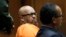 Former rap mogul Marion "Suge" Knight, left, with his defense attorney Albert DeBlanc Jr., listens to the terms of his plea of no contest to voluntary manslaughter in Los Angeles Superior Court, Sept. 20, 2018. 