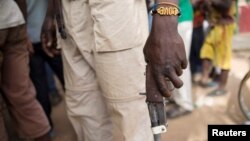 FILE - A member of the of the Anti-Balaka armed militia displays his weapon in the town of of Bocaranga, Central African Republic.