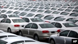 FILE - Volkswagen Jettas produced in Mexico for export are parked at the port terminal in the Gulf city of Veracruz, Mexico. 