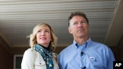 FILE - Nov. 8, 2016, file photo Sen. Rand Paul, R-Ky., and his wife Kelley Paul, speak with members of the media. Rand Paul waited more than a year to disclosure that his wife purchased stock in a company that makes a COVID-19 treatment.
