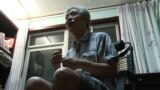 This screen grab taken from AFP video footage shows former professor Sun Wenguang talking in his home in Jinan, east China's Shandong province on August 28, 2013.