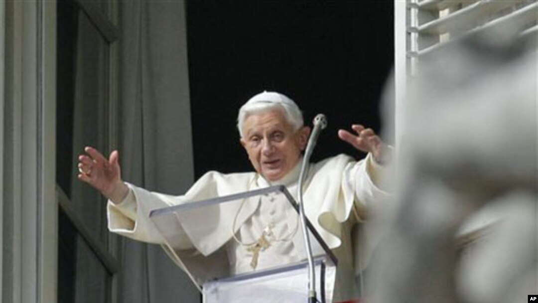 Pope Benedict XVI speaks from his studio window overlooking St. Peter's Square at the Vatican, 14 November 2010