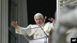 Pope Benedict XVI speaks from his studio window overlooking St. Peter's Square at the Vatican, 14 November 2010