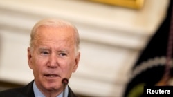 U.S. President Biden and Vice President Harris attend a meeting at the White House