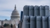 Security fencing is stacked near the U.S. Capitol building on the National Mall ahead of the Jan. 6 certification of the 2024 Presidential Election in Congress in Washington on Jan. 5, 2025. 