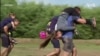 Couples Compete in Wife-Carrying Race in Hungary 