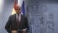 Spanish Economy Minister Luis de Guindos stands before a news conference after the weekly cabinet meeting in Moncloa Palace, in Madrid, Spain, November 15, 2012.