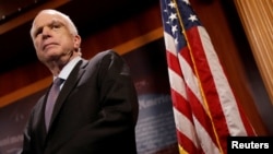 FILE - Senator John McCain (R-Az.) looks on during a press conference about his resistance to the so-called "Skinny Repeal" of the Affordable Care Act on Capitol Hill in Washington, July 27, 2017.