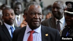 FILE - Zambia's President Michael Sata speaks to journalists at the 18th African Union summit in Ethiopia's capital, Addis Ababa, in 2012.