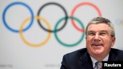 FILE - International Olympic Committee President Thomas Bach appears at a news conference in Monaco at which the organization unveiled its timeline for candidates for the 2024 Summer Games, Dec. 6, 2014.