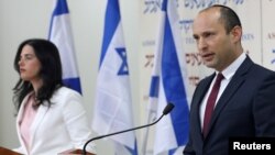Israeli Education Minister Naftali Bennett, right, and Justice Minister Ayelet Shaked, from the Jewish Home party, deliver statements in Tel Aviv, Dec. 29, 2018.