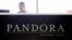 An employee works in the lobby of Pandora headquarters in Oakland, Calif., Tuesday, June 14, 2011