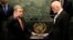 The United Nations Secretary-General designate Antonio Guterres, left, is sworn in by Peter Thomson, president of the UN General Assembly, at U.N. headquarters, Dec. 12, 2016. 
