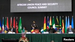 FILE - African leaders and delegates attend the Africa Union Peace and Security Council Summit on Terrorism at the Kenyatta International Convention Centre, in Nairobi, Kenya, Sept. 2, 2014.