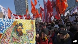 Opposition protesters with a placard depicting Czar Ivan The Terrible gathered during a rally in Moscow, Russia, March 10, 2012. 