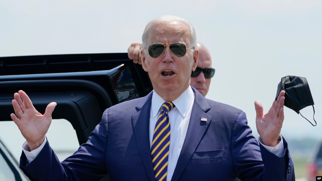 President Joe Biden responds to reporters' questions about infrastructure as he arrives at Lehigh Valley International Airport in Allentown, Pennsylvania, July 28, 2021. 