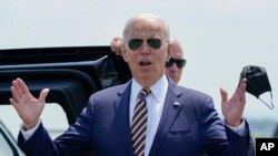 President Joe Biden responds to reporters' questions about infrastructure as he arrives at Lehigh Valley International Airport in Allentown, Pennsylvania, July 28, 2021. 