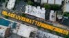 FILE - A giant "Black Lives Matter" sign is painted on Fulton Street, in the Brooklyn borough of New York City, June 15, 2020. 