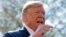 President Donald Trump speaks to members of the media on the South Lawn of the White House in Washington, before boarding Marine One helicopter, April 10, 2019. 