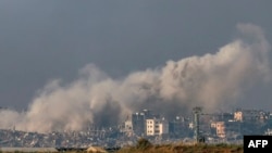 A picture taken in southern Israel near the border with the Gaza Strip on December 13, 2023, shows smoke billowing during Israeli bombardment on northern Gaza, amid continuing battles between Israel and the militant group Hamas.