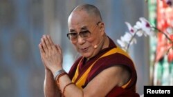 Exiled Tibetan spiritual leader, the Dalai Lama, speaks to his followers during the Jangchup Lamrim teaching session at the Gaden Jangtse Thoesam Norling Monastery in Mundgod in the southern Indian state of Karnataka, Dec.23, 2014.