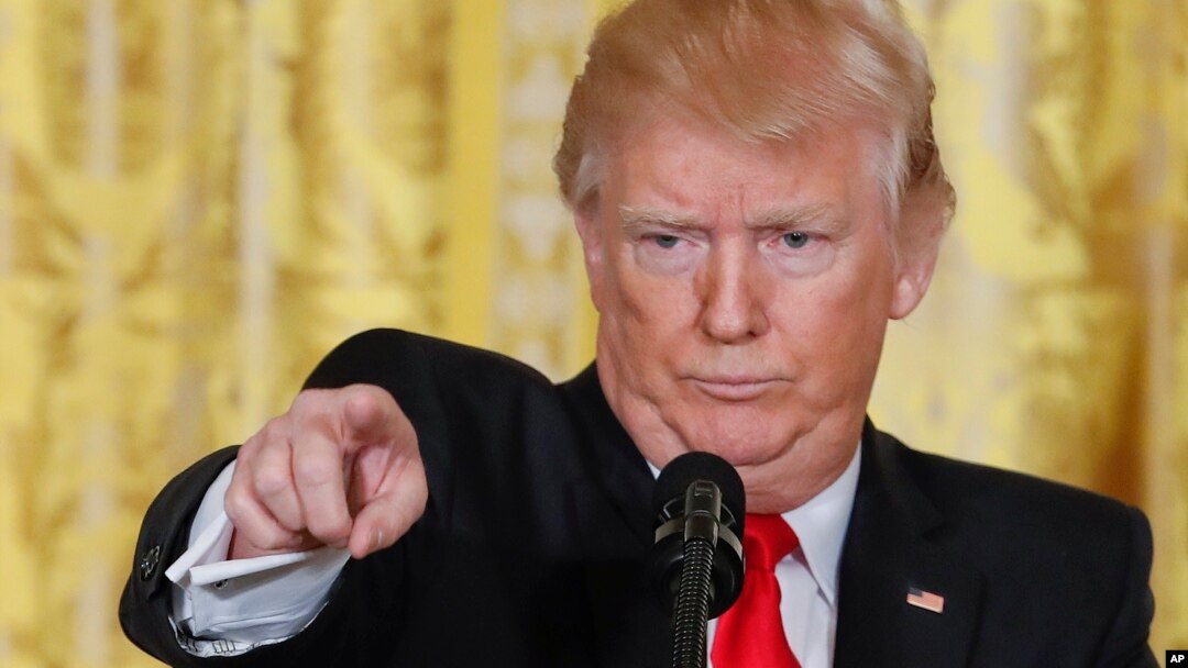 President Donald Trump points to a member of the media as he takes questions during a news conference in the East Room of the White House in Washington, Feb. 16, 2017.