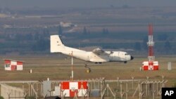 FILE - A German Air Force cargo plane maneuvers on the runway after landing at the Incirlik Air Base, near the city of Konya, southern Turkey, July 29, 2015.