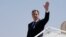 U.S. Secretary of State Antony Blinken waves as he boards a plane leaving Riyadh, Saudi Arabia, on October 15, 2023.