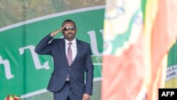 Ethiopian Prime Minister Abiy Ahmed salutes as members of Ethiopian National Defense Force parade during the 116th celebration of Ethiopian Defense Force day in Addis Ababa, Oct 26, 2023. 