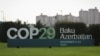 A view shows a sign of the COP29 United Nations Climate Change Conference with a backdrop of the cityscape in Baku, Azerbaijan, Oct. 31, 2024. 