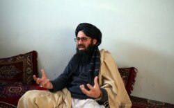 In this Dec. 14, 2019, photo, Maulvi Niaz Mohammad, 45, speaks during an interview with The Associated Press inside the Pul-e-Charkhi jail in Kabul, Afghanistan.