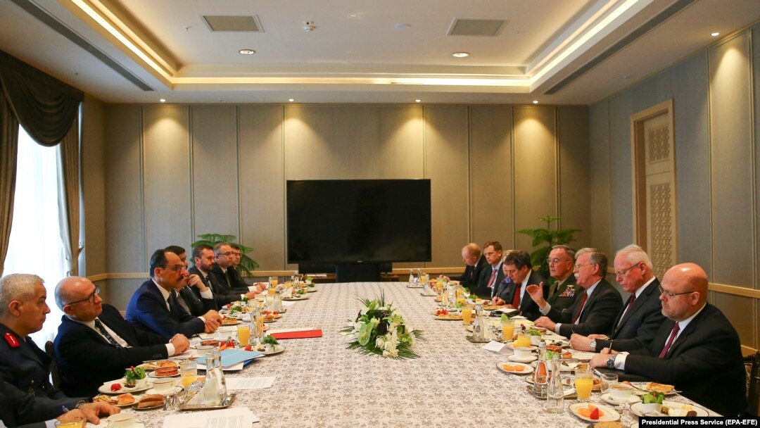 TURKEY -- U.S. National Security Adviser John Bolton and his Turkish counterpart Ibrahim Kalin are flanked by Turkish and U.S. officials as they meet at the Presidential Palace in Ankara, January 8, 2019 Photo: RSE/RL