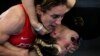 Germany's Anna Carmen Schell, right, reacts during her batlle against Egypt's Enas Ahmed at the women's 68kg freestyle wrestling match at the 2020 Summer Olympics in Chiba, Japan.