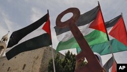 Palestinians take part in a demonstration to mark the 63rd anniversary of "Naqba," in Manger Square outside the Church of Nativity in the West Bank city of Bethlehem, May 12, 2011