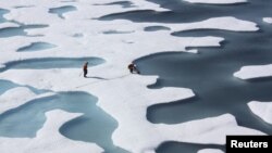 FILE -- The crew of the U.S. Coast Guard Cutter Healy, during its ICESCAPE mission, retrieves supplies in the Arctic Ocean, July 12, 2011.