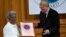 FILE - Mafron Ejigayehu (L) receives the Right Livelihood Award widely known as the Alternative Nobel Prize, on behalf of Catherine Hamlin of Ethiopia, from the founder of the prize journalist and professional philatelist Jakob von Uexkull at a ceremony i