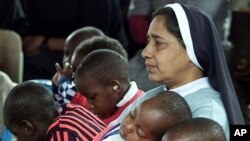 A nun sits among children with AIDS at Nyumbani children's home, Nairobi, Kenya, June 2001 (file photo).